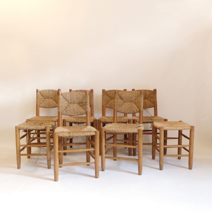 Set of six chairs and two stools by Charlotte Perriand.