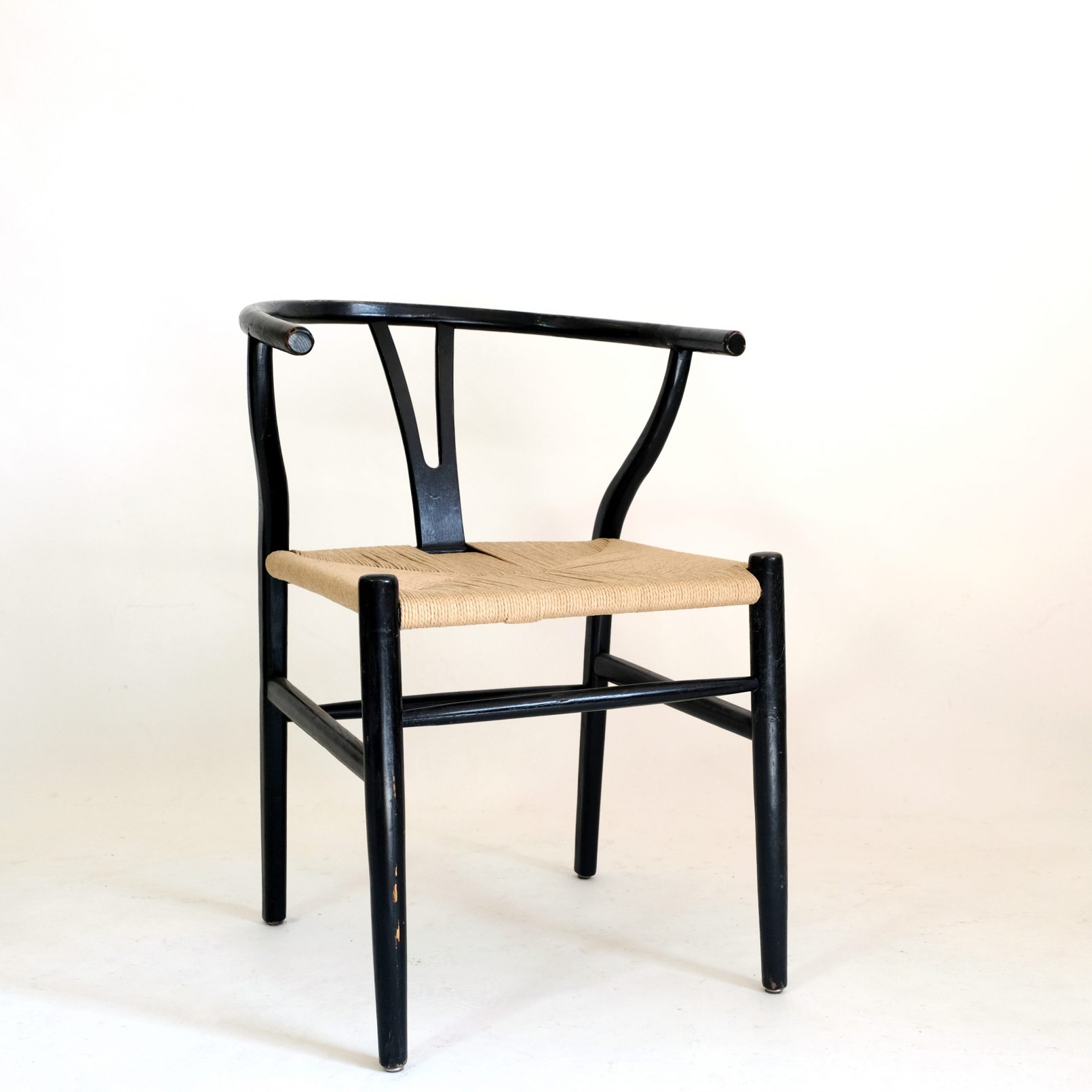 Chair from the seventies, black wood and rope.