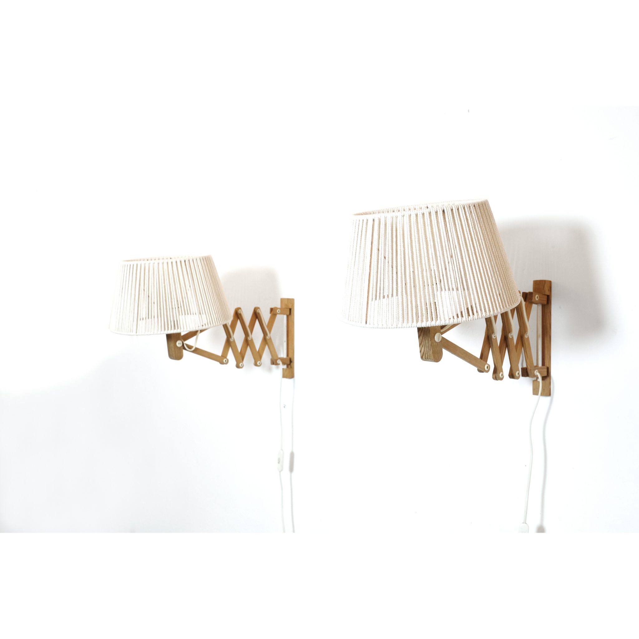 Pair of wooden wall mounted scissor lamps with cotton shades. — LampAndCo