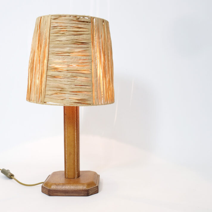 Leather table lamp and its raffia shade.