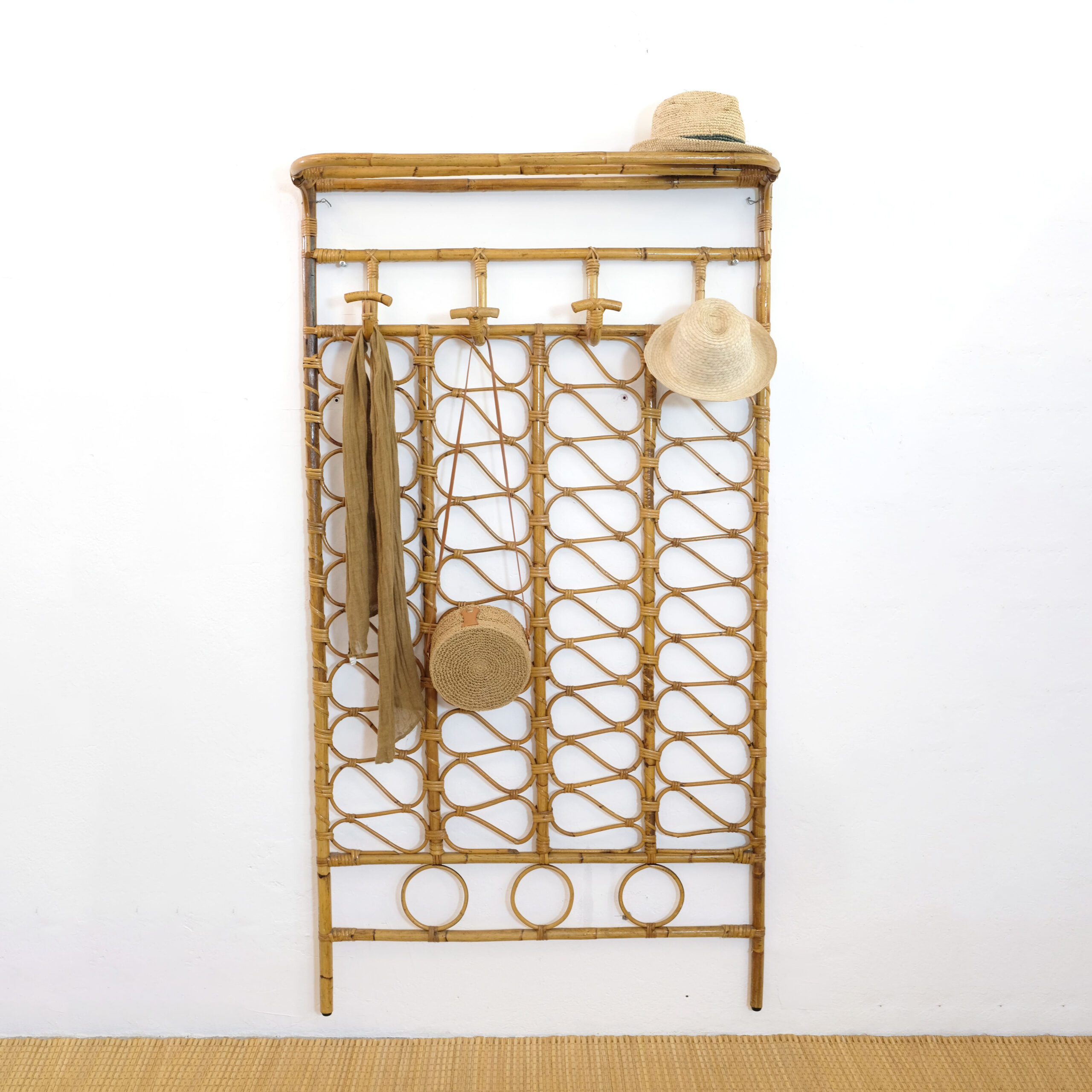Large Italian rattan coat hanger from the sixties.