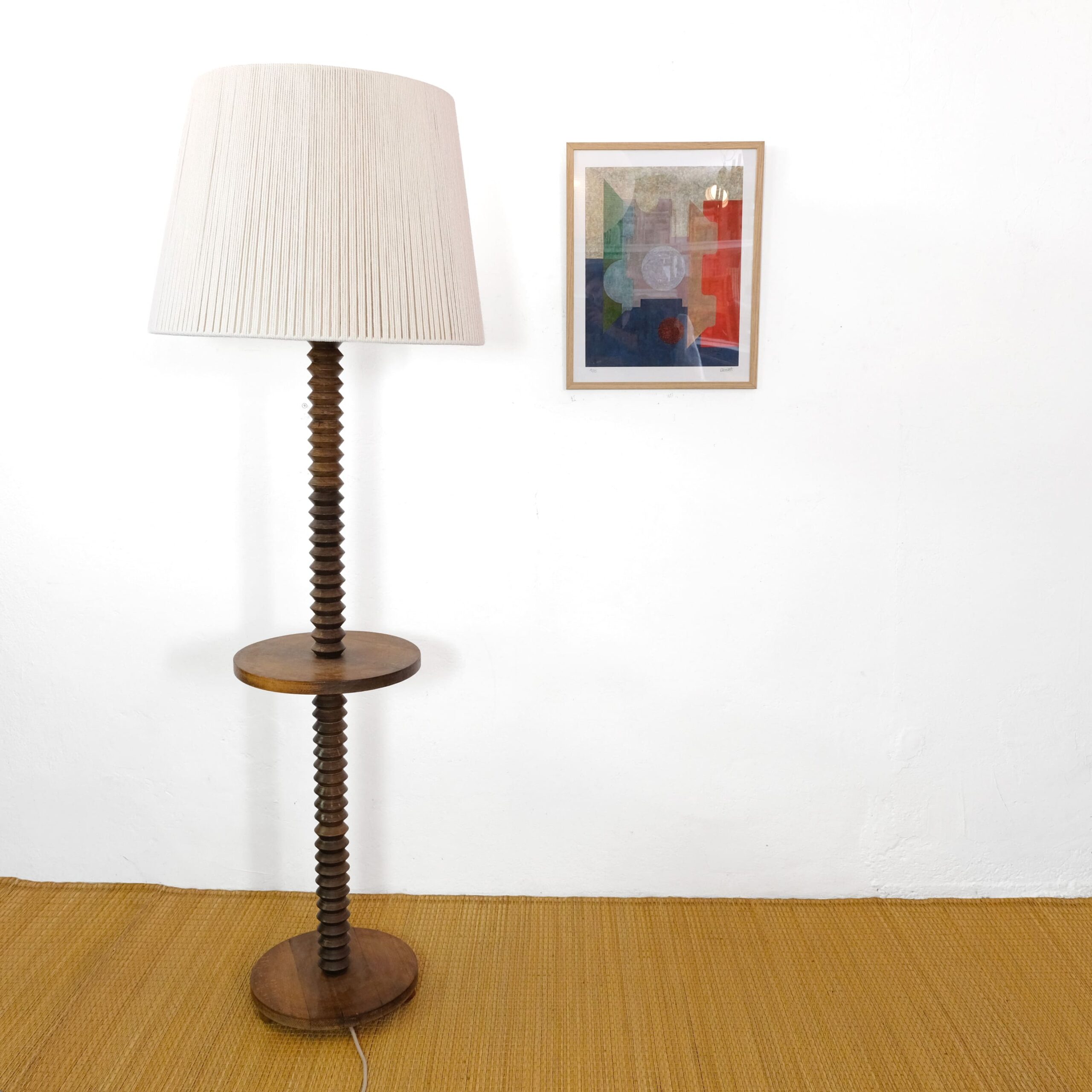 Floor lamp with a turned wooden base, circa 1940.